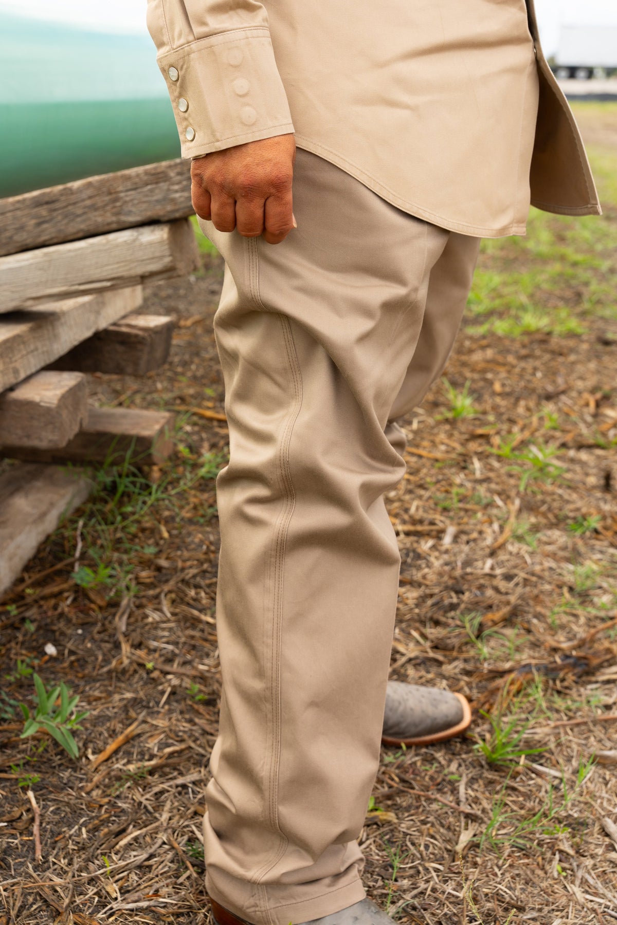 Side view of the khaki FR COOLBACKS® Work Pants showing the straight-leg fit